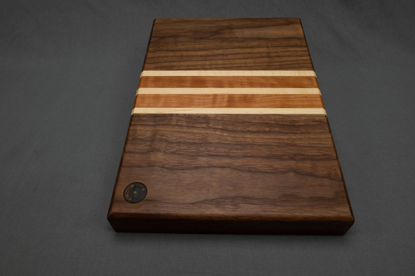 Face grain walnut cutting board with cherry and maple accent stripes - McGary Woodworks