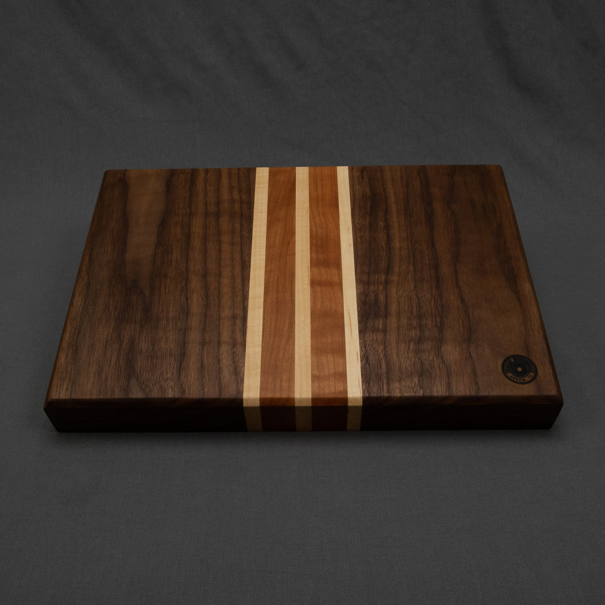 Face grain walnut cutting board with cherry and maple accent stripes - McGary Woodworks